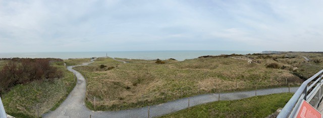 The shell-cratered headland at Pointe du Hoc above the sea
