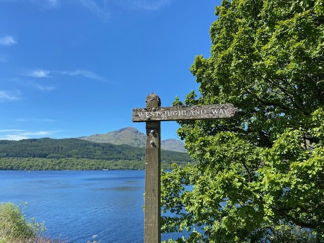 Loch Lomond from the West Highland Way, with a wooden waymarker
